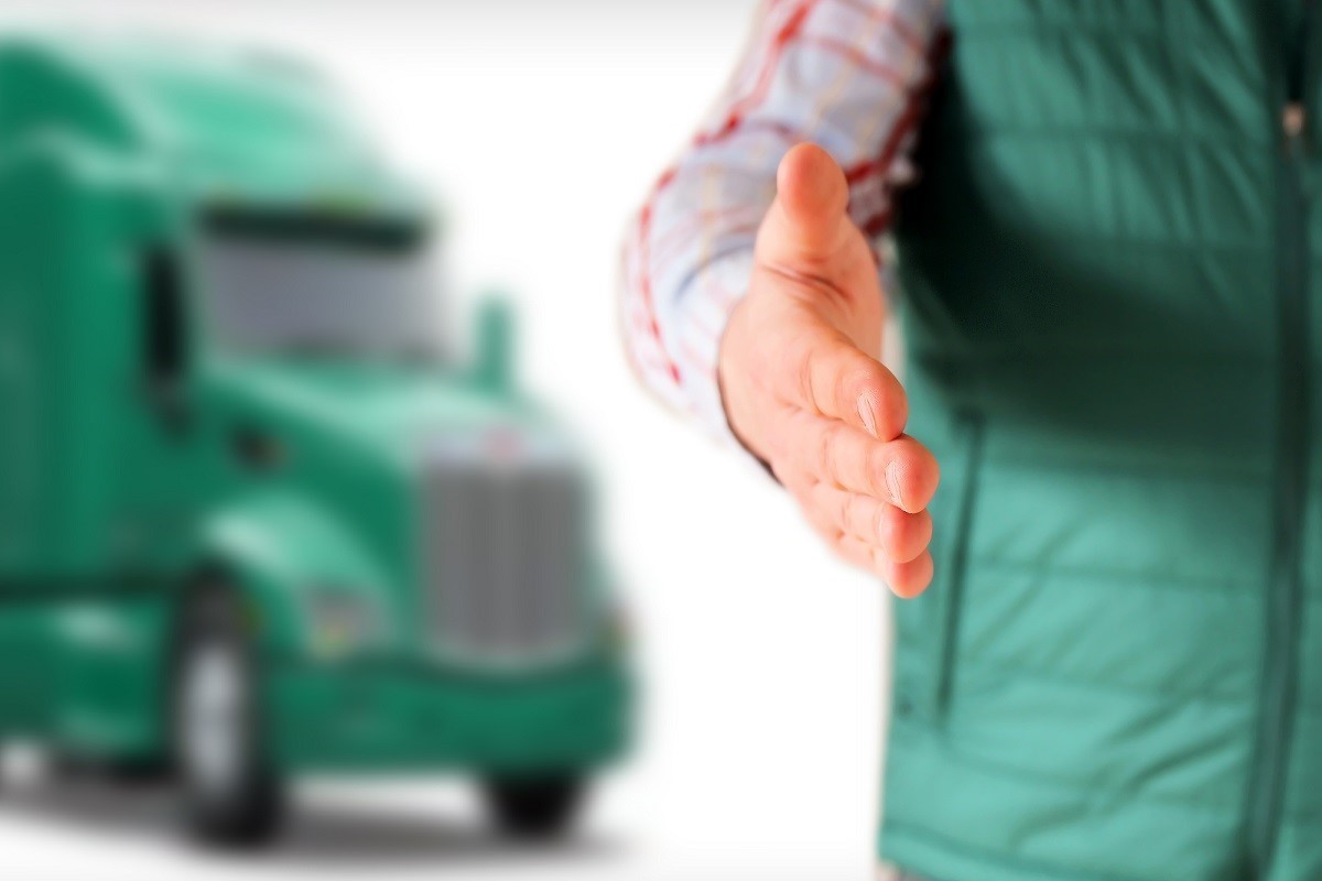 truck driver extending hand out